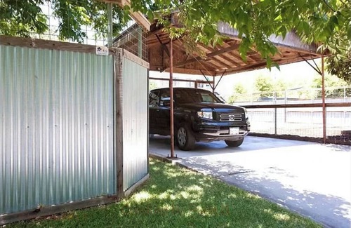North Loop House | 2-3 BR house with big fenced yard & private carport