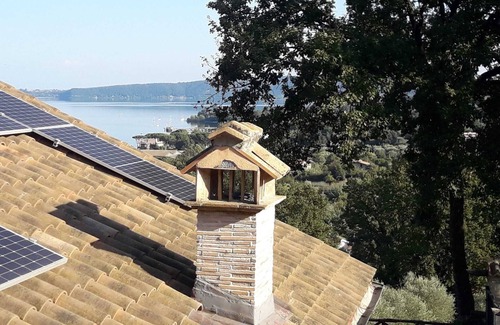 Lake Bracciano Villa | Breathtaking view of the lake and castle surrounded by holm oaks and oaks