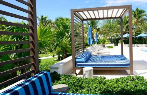 Nassau House | Cable Beach Condo Large private patio with BBQ