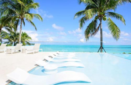 Nassau House | Cable Beach Condo Large private patio with BBQ