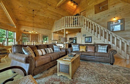 Mineral Bluff Cabin | Eagle Ridge, is pet-friendly haven with a full fenced area and offers awe-inspiring mountain views, a bubbling hot tub, cozy outdoor fireplace, and reliable WiFi.