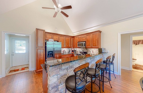 Hardwick House | Inviting waterfront home with fireplace, dock, patio, central AC, & W/D