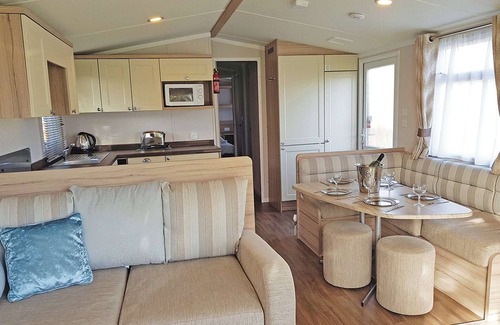 Cross Inn House | Modern caravan with one double and two twins.