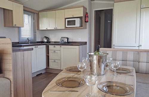 Cross Inn House | Modern caravan with one double and two twins.