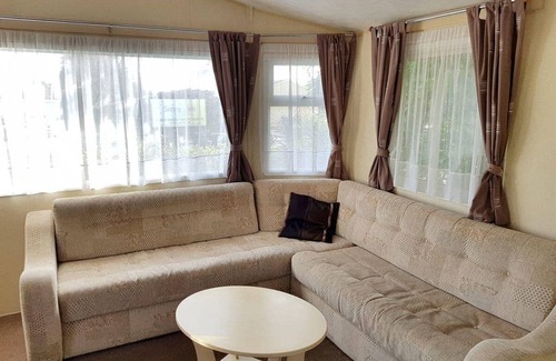 Cross Inn House | Modern caravan with one double and two twins.