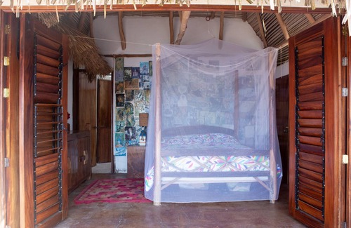 Mayto Cottage | Remote, romantic jungle palapa overlooking the ocean with 3 beds, kitchen + bath