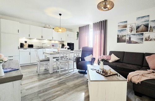Tossens Apartment | StrandGut 49 - Penthouse with a view. Sauna. Roof terrace. Exclusive.