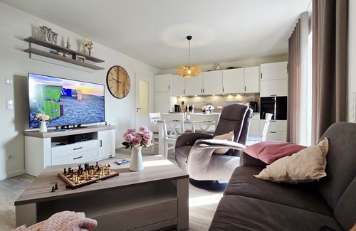 Tossens Apartment | StrandGut 49 - Penthouse with a view. Sauna. Roof terrace. Exclusive.