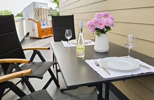 Tossens Apartment | StrandGut 49 - Penthouse with a view. Sauna. Roof terrace. Exclusive.