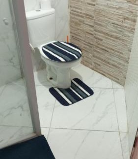 Praia Grande Apartment | Suíte frente mar