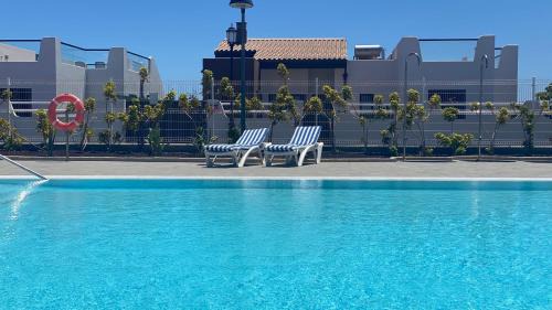 Caleta de Fuste Apartment | Sunny Luxury Apartment with two great sunny - level terraces, two swimming pools, in a new complex Pueblo Majorero, close to Fuerteventura Golf Club, next to the beach , Atlantico Shopping Mall and casino in Caleta de Fuste