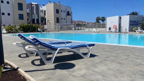 Caleta de Fuste Apartment | Sunny Luxury Apartment with two great sunny - level terraces, two swimming pools, in a new complex Pueblo Majorero, close to Fuerteventura Golf Club, next to the beach , Atlantico Shopping Mall and casino in Caleta de Fuste