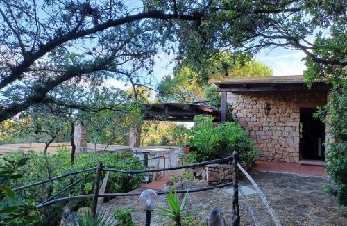 Trinita d'Agultu e Vignola House | Villa La Lecceta surrounded by greenery and sea view with sunset
