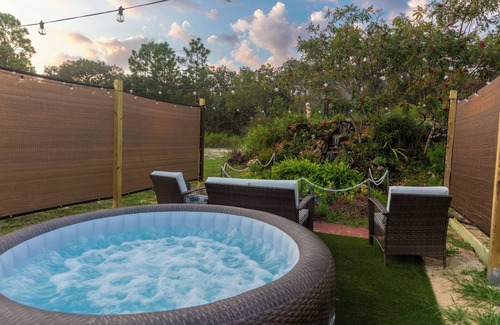 Sugarmill Woods Cabin | Waterfall Suite at Zen at the Palms with a Private Hot Tub by the Waterfall!