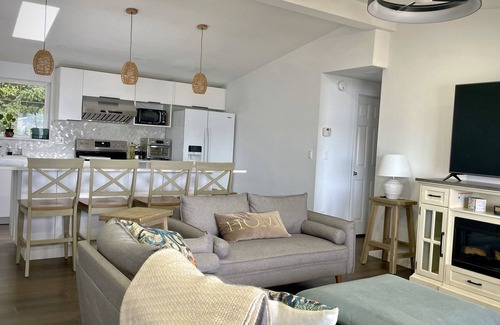 Silverdale House | Waterfront bungalow with 2-bed house and studio connected via spacious deck.