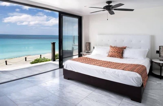 Beachfront modern comber townhouse with pool at Ffryes Beach