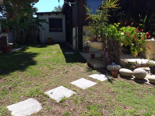 Brezza di mare appartamento in Villa con giardino e spiaggia ,casa vacanze al mare