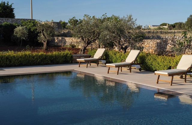 Cici and Michela estate surrounded by greenery with private pool