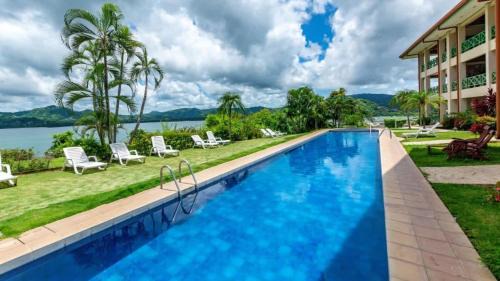 Elegant Condo with Brand-New Fixtures, Shaded Tropical Terrace, and Secluded Beach Access