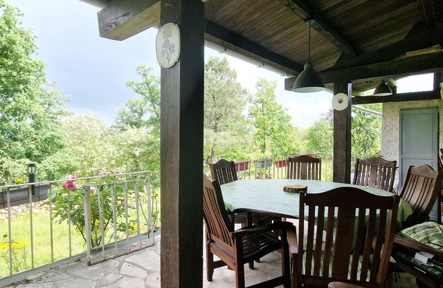 Large house with covered terrace in the countryside, panoramic view