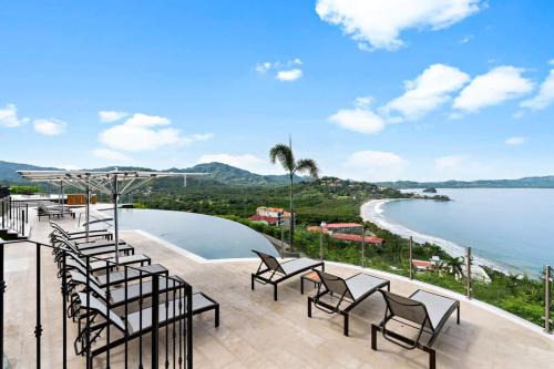 Luxury Condo with Panoramic Ocean Views, Sparkling Infinity Pool, and Modern Open-Concept Design