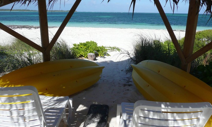 Winding Bay Villa | A luxury beachfront villa, surrounded by palms, with superb views of Winding Bay