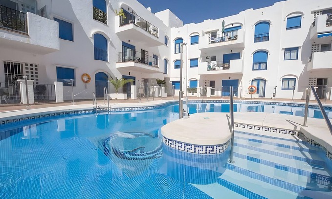 Manilva Apartment | Apartment 'Brisa Del Puerto' with Shared Pool, Wi-Fi and Air Conditioning