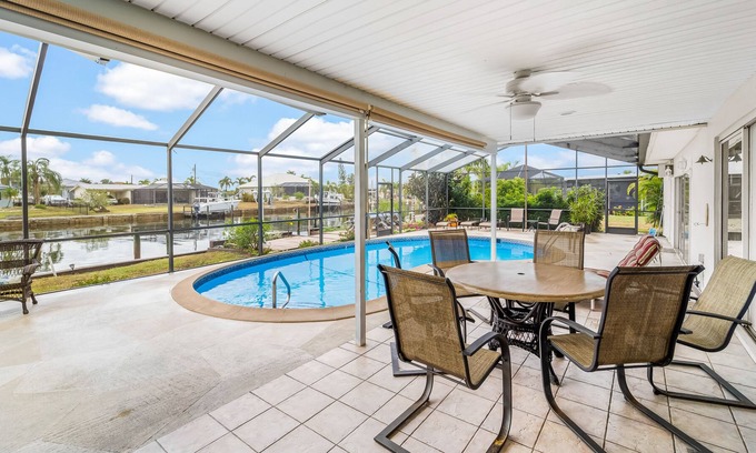 Edgewater House | Canal-front home with deep-water dock, pool, lanai, & central AC - snowbirds OK