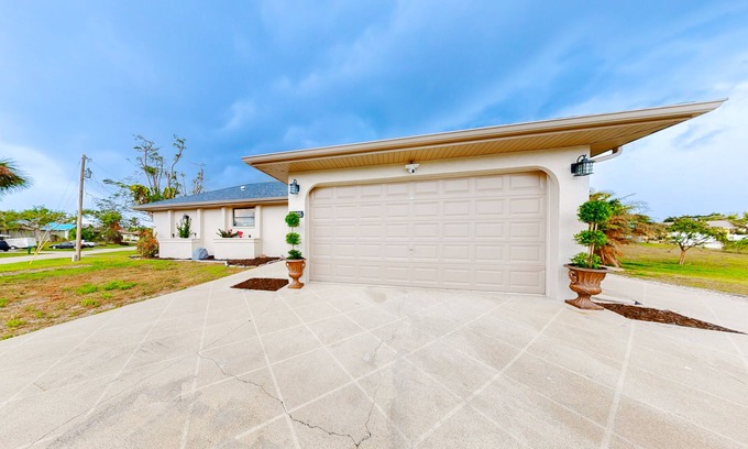 Charlotte Park House | Canal-front home with private dock, pool, screened lanai, & W/D