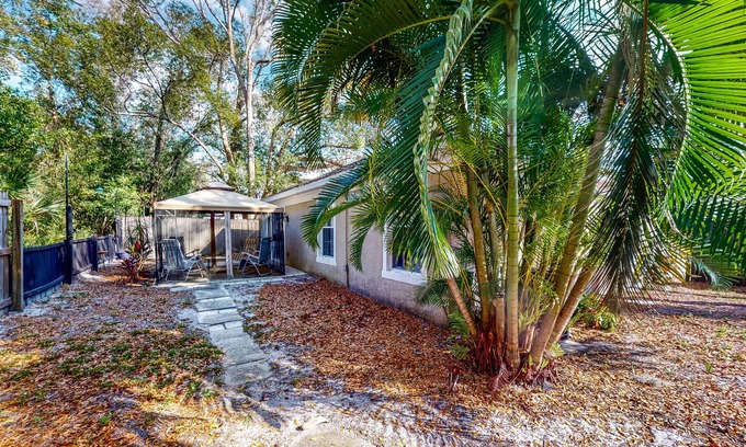 Casselberry House | Centrally located home with a firepit, large yard