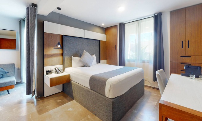 Downtown Cancun Hotel | Charming condo with kitchenette, balcony, & pool