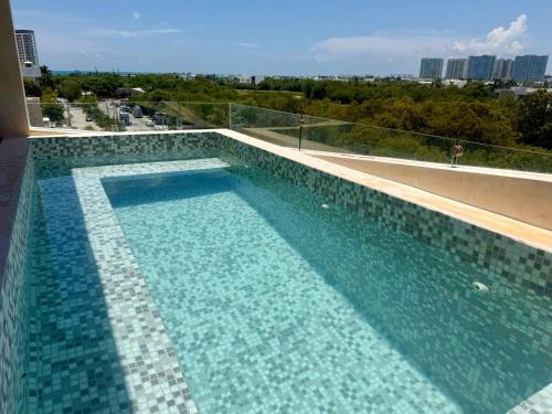Downtown Cancun Apartment | Chichén 27 Departamentos nuevos con piscina cerca de Ferry a Isla Mujeres