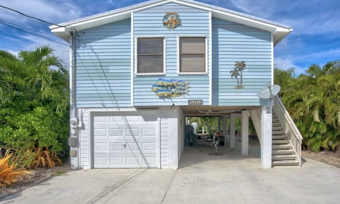 Eden Pines House | Lower Keys on quiet canal front w/boat lift, screened-in porch & Pets Welcome!