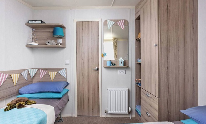 Cross Inn House | Modern caravan with one double and two twins.