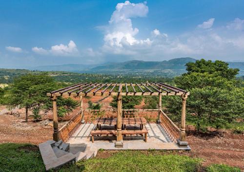 Ambavna Villa | SaffronStays Niramay, Torna-Rajgad - rustic pool villa with a gazebo and great forest views