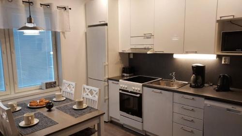 Sotkamo Apartment | Saunallinen lomakaksio Sotkamon keskustassa