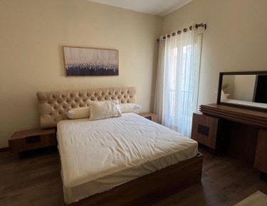 One-Bedroom Apartment with Balcony and City View