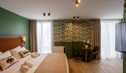 One-Bedroom Apartment with Balcony and City View