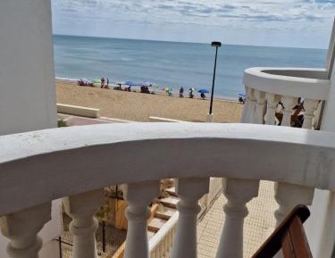 Double room with two beds and partial sea view