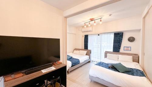 Deluxe Room with Kitchen (2 Double Beds and 1 Sofa Bed) - Non-Smoking