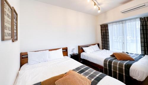 Deluxe Room with Kitchen (2 Double Beds and 1 Sofa Bed) - Non-Smoking