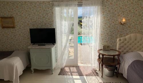 Large Double Room with 2 Extra Beds and Shared Bathroom