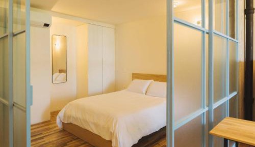 One-Bedroom Apartment with Balcony and City View