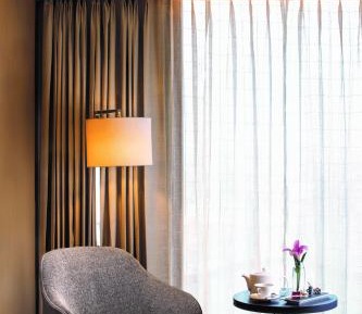 Executive Room with alcoholic / non - alcoholic house drinks , a platter of Fruits and Cookies , 01 way airport transfers, 10% off on food & soft beverages, complimentary sauna and steam once during the stay, ( early check in and late check out by 4 Hrs )