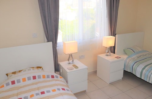 Peyia Town House | Direct access to the pool from the garden. A sandy beach is a few minutes away.