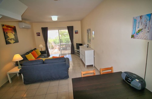 Peyia Town House | Direct access to the pool from the garden. A sandy beach is a few minutes away.