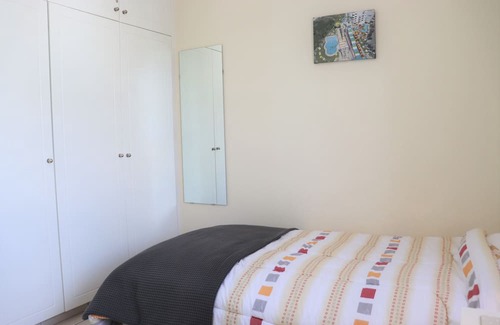 Peyia Town House | Direct access to the pool from the garden. A sandy beach is a few minutes away.