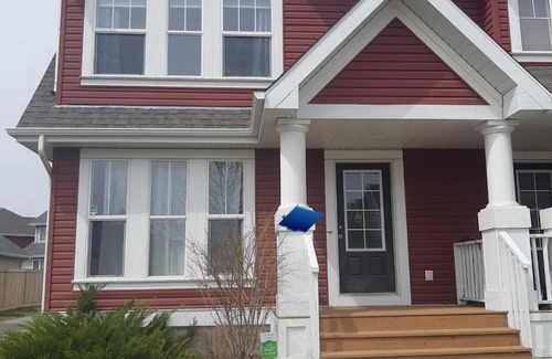 Southeast Edmonton House | House in Summerside with a huge patio and an extra tall garage