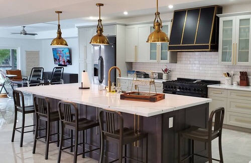 Caloosahatchee House | Custom Home with tile pool, boating dock and every comfort