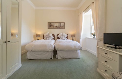 Livingston Cabin | This spacious twin room, located on the first floor, boasts relaxing neutral decor,